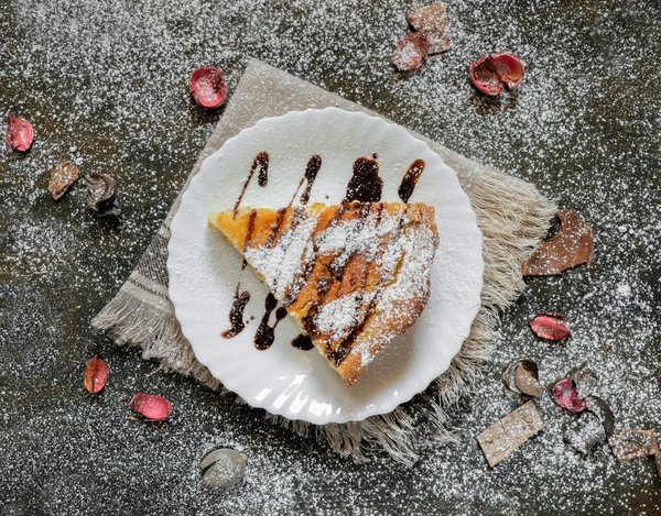 Qual è la ricetta per una pastiera napoletana con grano cotto e ricotta?